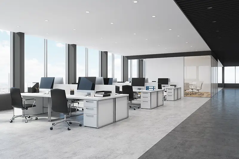Side view of white and black open space office interior with rows of computer tables with desktops 