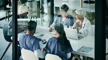 Group of people working in a medical field having a meeting