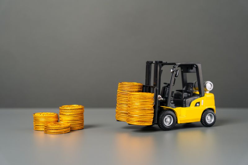 Forklift Lifting Stacks of Gold Coins Concept