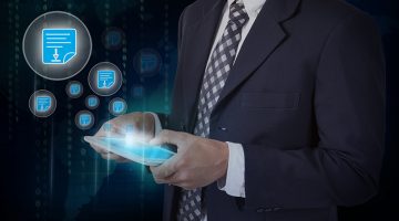 Businessman hand touch screen pdf icons on a tablet