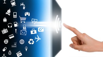 Modern communication technology with human finger touching a screen