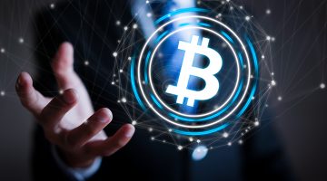 Businessman with hands offers bitcoin concept.