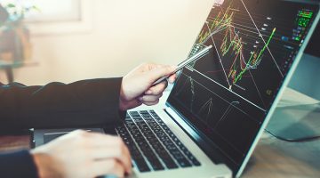 business people working with stock trading forex with technical indicator tool on laptop