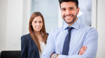 Couple of smiling business people