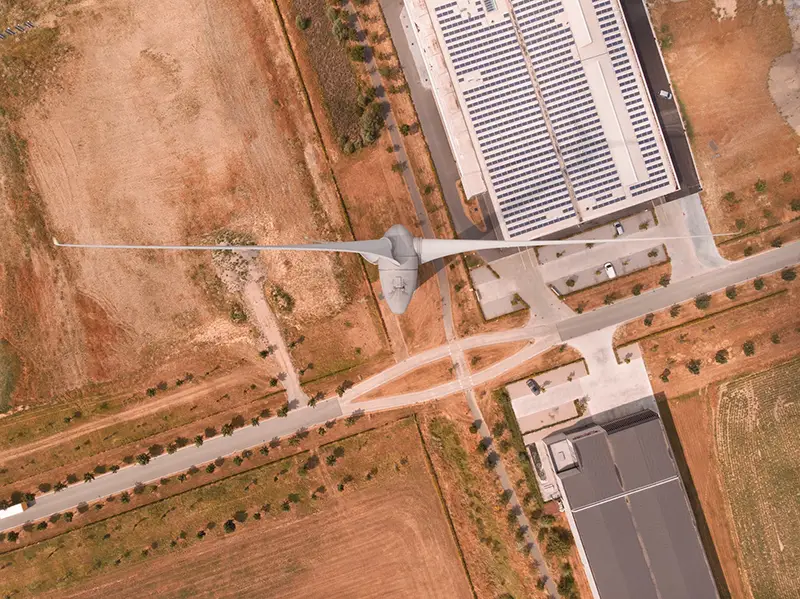 Air drone shot of wind turbine in desert