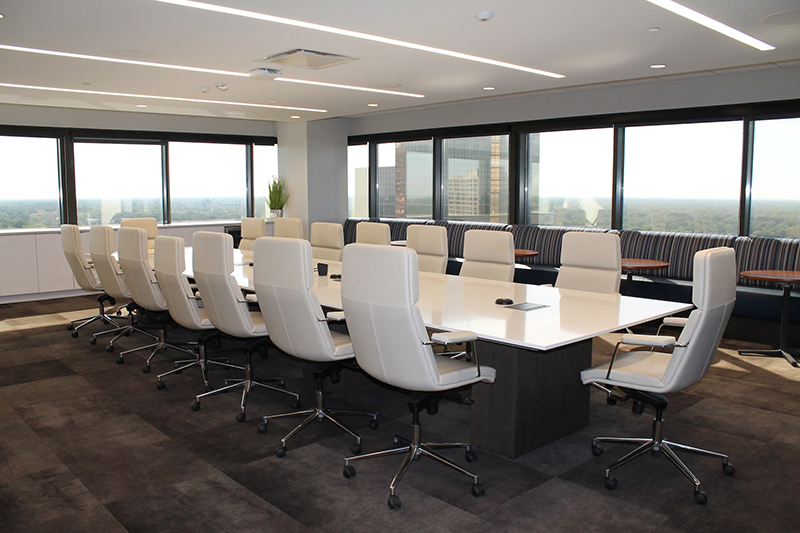 White and gray rolling chairs inside the meeting room