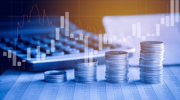 Stack of money coin on accounting sheet