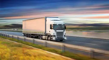 Truck with container on highway