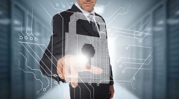 Businessman selecting a futuristic padlock