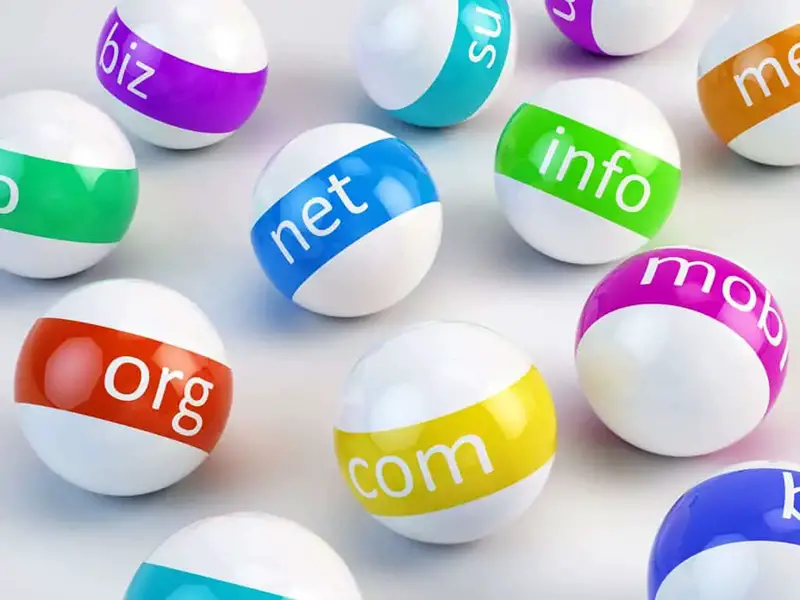 White balls with colorful text of domain names