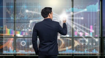 trading graph over the virtual screen on the blurred of cityscape background