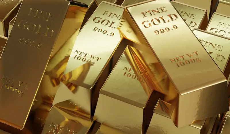 Pile of arranged gold bars of 1000g net weights