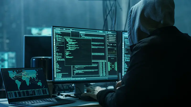 Dangerous Hooded Hacker Breaks into Government Data Servers and Infects Their System with a Virus.