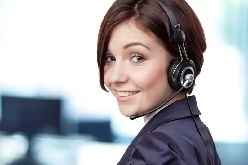 Smiling woman wearing black headset