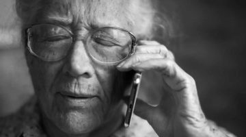 Senior old woman using mobile phone