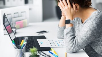 stressed web designer with user interface layout