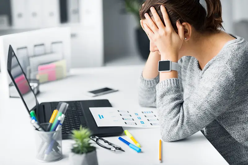 stressed web designer with user interface layout