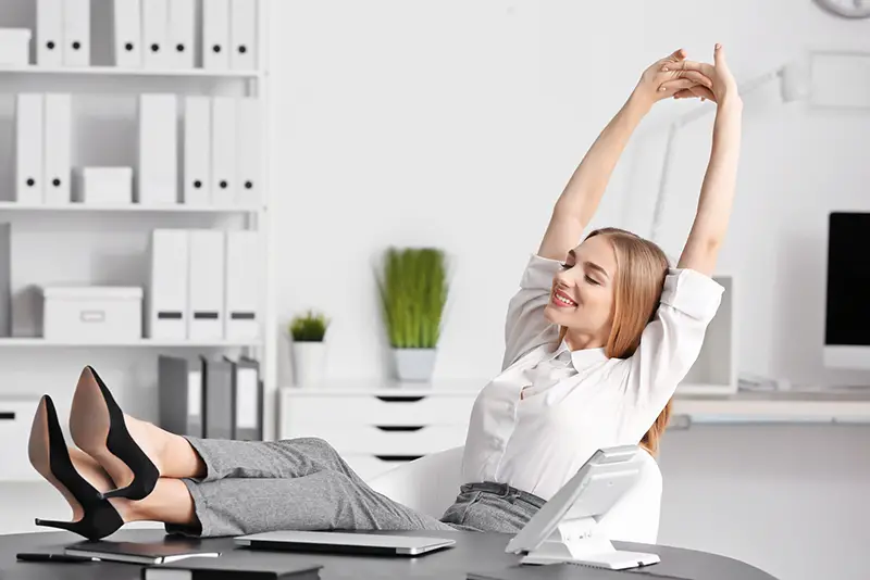 Young businesswoman relaxing in office