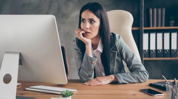 Shocked frustrated girl agent work remote look screen computer