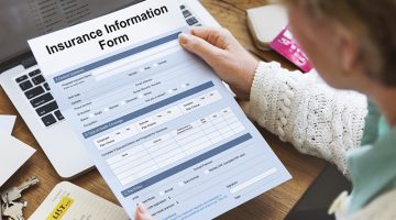 Senior woman with application paper