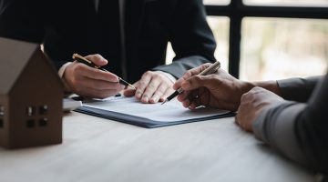 Real estate agents explain models of housing estates in projects