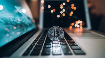 Macro shot of Bitcoins coins on laptop