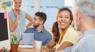 employees working in background at creative office