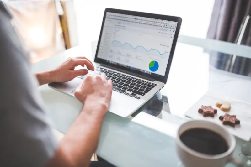 Person working on laptop with Google analytics on computer screen