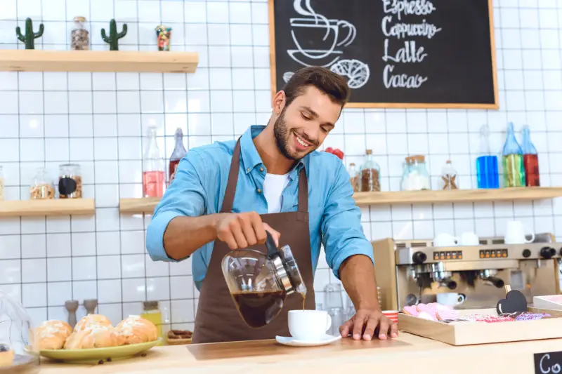 Barista pouring coffee