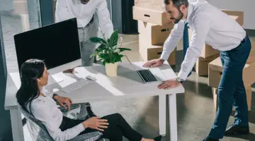 High angle view of multiethnic colleagues working in new office