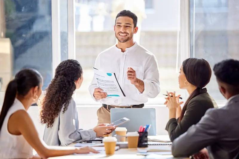 Staff, presentation and business man in a meeting, teamwork and planning with brainstorming, feedback and review.