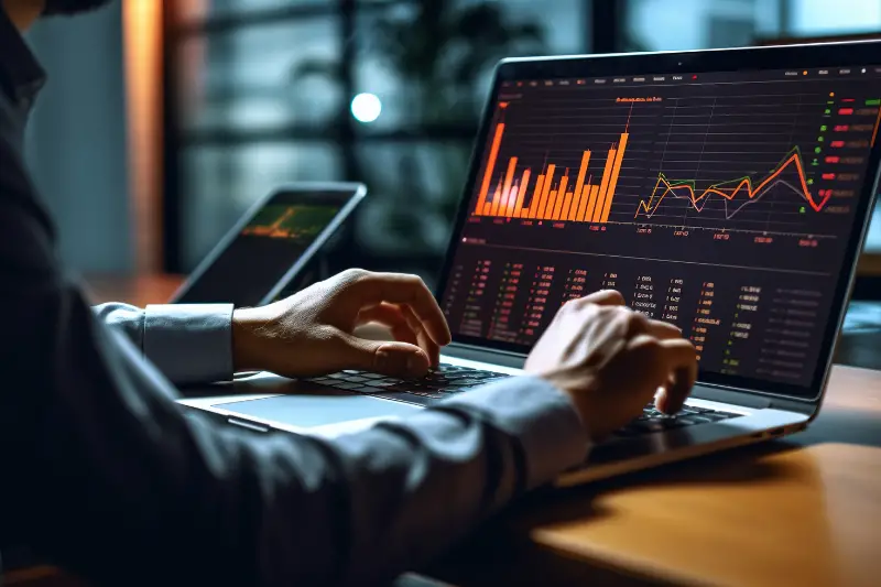 Cropped photo of businessman analyzing business diagram, marketing statistics and finance market graphs on laptop monitor in the office.