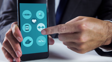 Composite image of businessman using smartphone