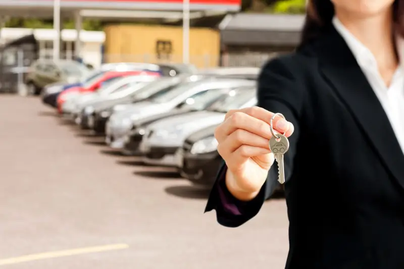 Businesswoman holding a key