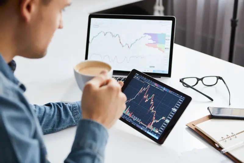 Investor watching the change of stock market on tablet