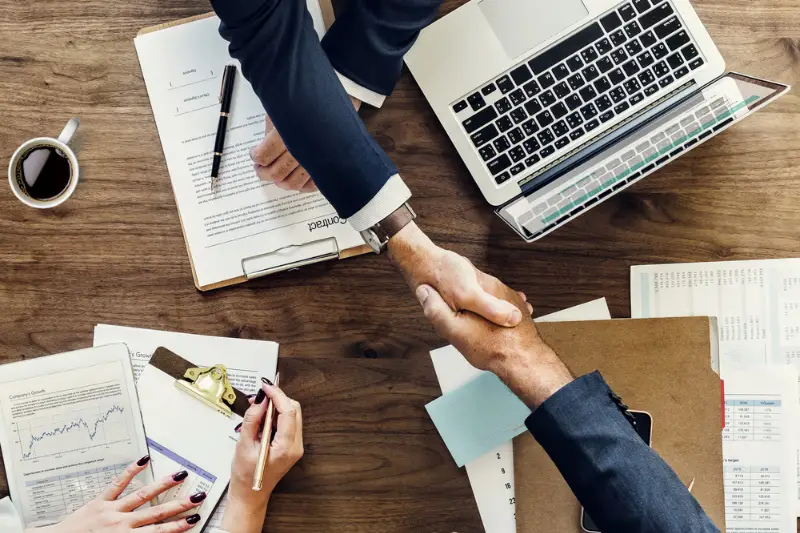 Business people shaking hands