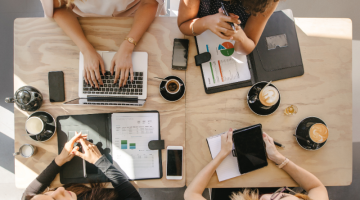 Group of women working together in coffee shop