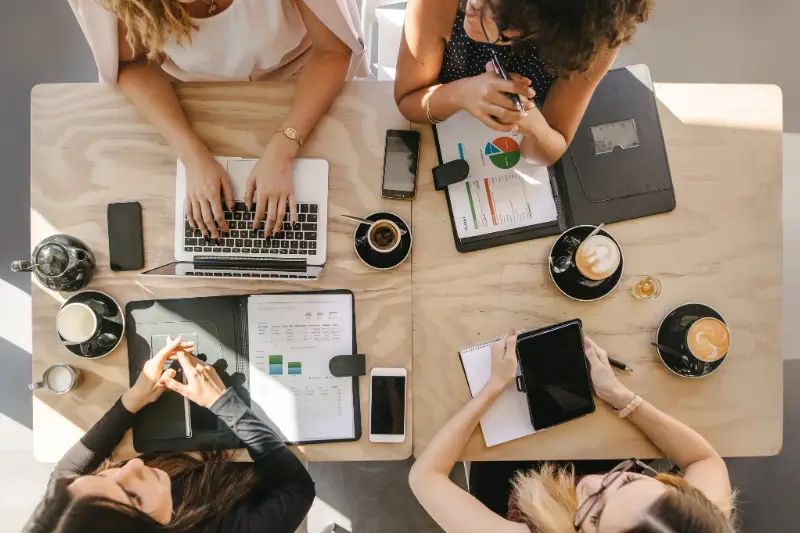 Group of women working together in coffee shop