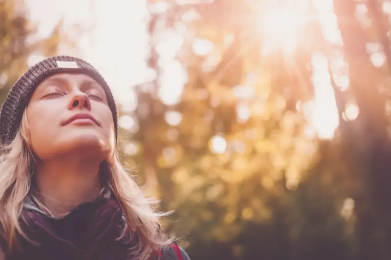 Young woman hiking and going camping in nature