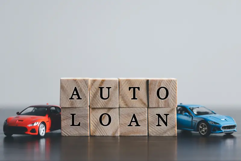 word AUTO LOAN writeen on wooden cubes