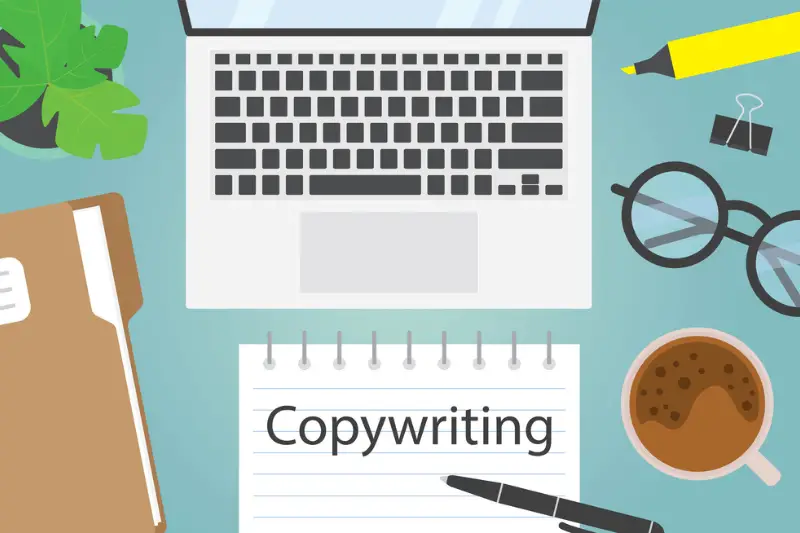 Copywriting written in spiral notebook on office desk