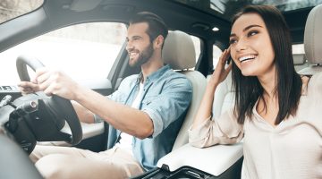 Beautiful couple driving car