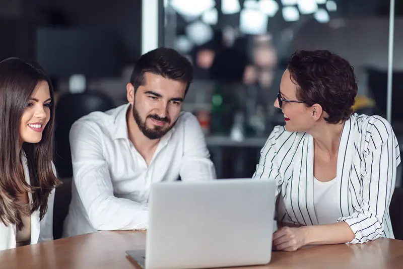 Couple meeting financial adviser for home investment contract