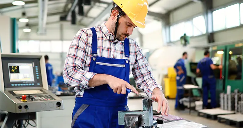 industrial factory employee working in metal manufacturing industry