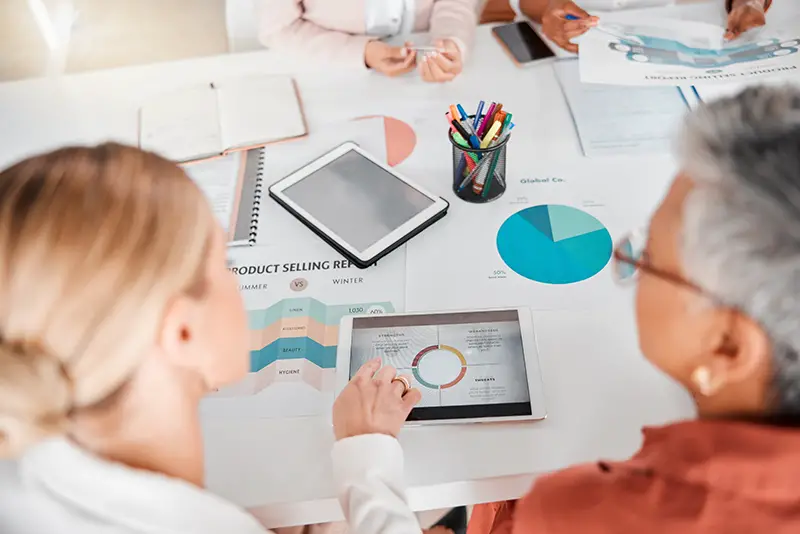 Teamwork, marketing agency or business people on tablet in meeting for company growth