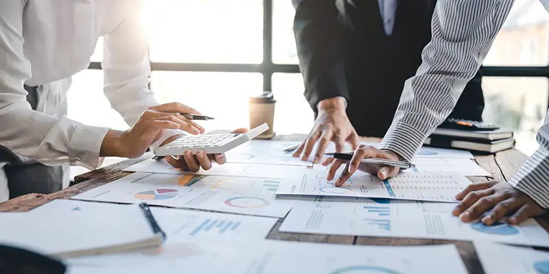 Businesswoman or accountant working Financial investment on calculator, calculate, analyze business and marketing growth on financial document data graph, Accounting, Economic, commercial concept