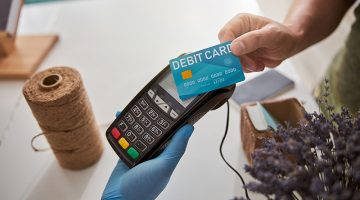 Man is paying with a debit card