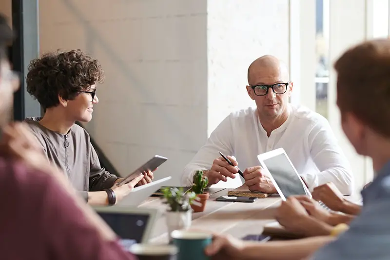 Man sitting in front of people