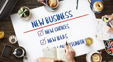 Table with poster with New Business