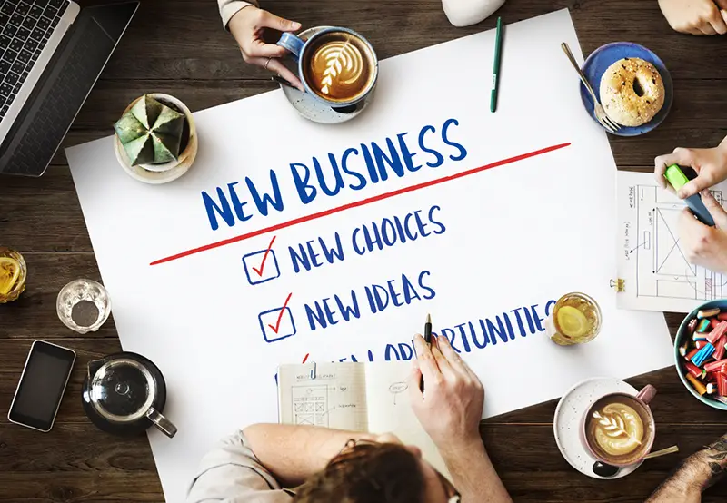 Table with poster with New Business